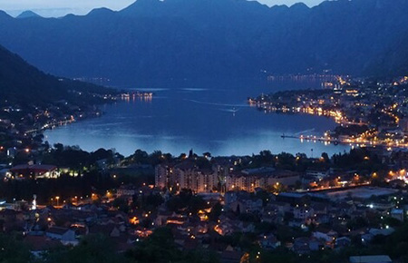 Sea in Kotor and city night lights